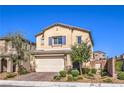 Charming two-story home with a well-manicured front yard, landscaping and a two-car garage at 7045 Judith River St, North Las Vegas, NV 89084