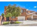 Lovely two-story home featuring an attractive front yard with metal fence, a two-car garage, and proximity to other houses at 7959 Palace Monaco Ave, Las Vegas, NV 89117