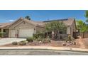 Attractive single-story home with desert landscaping, a two-car garage, and a sunny front facade at 8777 Shady Peak Way, Las Vegas, NV 89123