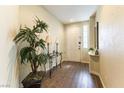 Welcoming entryway featuring wood-look floors, neutral paint, and decorative accents at 922 Lloyd George Dr, Henderson, NV 89052