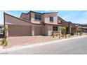 Beautiful two-story home with a brick driveway and a three-car garage at 9314 Observatory St, Las Vegas, NV 89143
