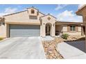 Charming single-story home with a two-car garage and inviting desert landscaping at 9393 New Utrecht St, Las Vegas, NV 89178