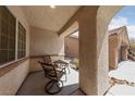 Cozy front porch with seating, creating an inviting outdoor space at 9393 New Utrecht St, Las Vegas, NV 89178