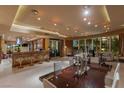 Open dining and living area with sleek furnishings, bar seating, and views of the Las Vegas skyline at 1 Hughes Center Dr # 308, Las Vegas, NV 89169