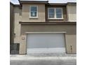 Attached two-car garage, providing convenient and secure parking for residents of this modern home at 11394 Crimson Ledge Ave, Las Vegas, NV 89138