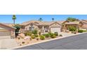 Single-story home with desert landscaping, decorative stone accents, and a convenient two-car garage at 1309 Vista Del Monte Dr, Mesquite, NV 89027