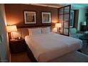 Well-decorated bedroom featuring a plush king bed, modern lighting, and comfortable seating at 145 E Harmon Ave # 27619, Las Vegas, NV 89109
