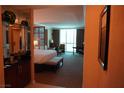 View of main bedroom with king bed, desk, and seating area at 145 E Harmon Ave # 27619, Las Vegas, NV 89109