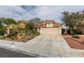 Attractive single-story property showcasing a tile roof, low-maintenance landscaping, and a two-car garage at 1632 Royal Canyon Dr, Las Vegas, NV 89128