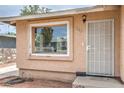 Close up view of front exterior with a large window and security door at 240 N 19Th St, Las Vegas, NV 89101