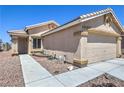 Inviting single-story home with a well-manicured front yard and security door at 2595 Amber Crest St, Las Vegas, NV 89142