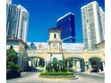 Elegant gated community entrance with manicured landscaping and striking high-rise buildings in the background at 2747 Paradise Rd # Ph 3604, Las Vegas, NV 89109