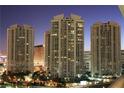 Spectacular view of the high-rise buildings with illuminated windows against the twilight sky, creating a dynamic urban landscape at 2777 Paradise Rd # 1505, Las Vegas, NV 89109