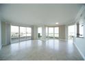 Bright and airy living room with tile floors, large windows, and sliding doors to a balcony at 2777 Paradise Rd # 1505, Las Vegas, NV 89109