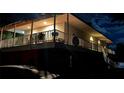 Exterior view of home at night, with a covered balcony space perfect for outdoor seating and entertaining at 2855 Rice St, Logandale, NV 89021
