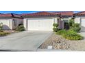 Charming single-story home with a two-car garage and well-manicured landscaping at 450 Intrepid Ct, Boulder City, NV 89005