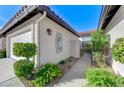 Charming home with a two-car garage, walkway, gated courtyard, and manicured landscaping at 450 Intrepid Ct, Boulder City, NV 89005