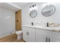 Modern bathroom with double sink vanity, stylish mirrors, and a walk-in shower at 517 N 22Nd St, Las Vegas, NV 89101