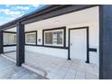 Charming tiled front porch featuring contrasting trim and a secure front door at 517 N 22Nd St, Las Vegas, NV 89101