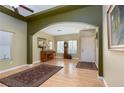 An open living area with laminate floors and decorative rugs, paint scheme is neutral and calming at 5229 Giallo Vista Ct, North Las Vegas, NV 89031