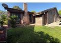 Charming brick home with a cozy front yard and a brick chimney under a bright blue sky at 6521 Sugarpine Ln, Las Vegas, NV 89107