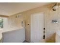 Entryway with a white door, number 2084, and textured walls at 7200 Pirates Cove Rd # 2084, Las Vegas, NV 89145