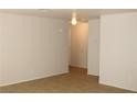A well lit living room area featuring tile flooring and base molding at 730 Goshawk St, Henderson, NV 89015