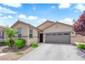 Charming single-story home features a well-maintained front yard and a two-car garage at 9467 Samuel Clemens Ct, Las Vegas, NV 89147