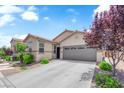 Charming single-story home features a well-maintained front yard and a two-car garage at 9467 Samuel Clemens Ct, Las Vegas, NV 89147