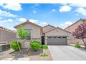 Charming single-story home features a well-maintained front yard and a two-car garage at 9467 Samuel Clemens Ct, Las Vegas, NV 89147