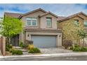 Charming two-story home with a well-manicured lawn and a spacious two car garage at 10031 Fletcher Peak Ave, Las Vegas, NV 89178