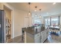 Modern kitchen featuring an island with seating and stainless steel appliances at 10031 Fletcher Peak Ave, Las Vegas, NV 89178