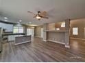 Open-concept living area featuring an island kitchen with stainless steel appliances at 10279 Montes Vascos Dr, Las Vegas, NV 89178