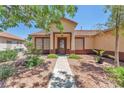 Inviting single-story home with a well-kept garden and covered entryway at 1038 Beaver Crest Ter, Henderson, NV 89015