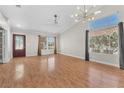 Bright, airy living room featuring hardwood floors, high ceilings, and ample natural light at 1038 Beaver Crest Ter, Henderson, NV 89015