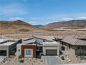 View of the home with desert landscape and mountain views at 11173 Concord Valley Dr, Las Vegas, NV 89135