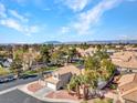Well-maintained two-story home featuring desert landscaping, a neutral exterior, and a tile roof in a desirable community at 125 Firecreek Cir, Las Vegas, NV 89107