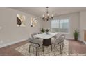Traditional dining room featuring a marble table set under an elegant chandelier at 1312 Fragrant Spruce Ave, Las Vegas, NV 89123