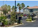 Gated community entrance with lush landscaping at 1370 Crystal Hill Ln # 3, Henderson, NV 89012