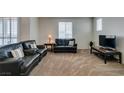 Cozy living room with plush carpet and ample seating at 1370 Crystal Hill Ln # 3, Henderson, NV 89012