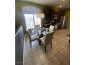 Charming eat-in kitchen featuring stainless appliances, dark cabinets, and a sunlit window at 1511 Cardinal Peak Ln # 201, Las Vegas, NV 89144