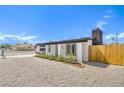 Newly renovated exterior of home with modern design and low maintenance desert landscaping at 1600 E Mcdonald Ave, North Las Vegas, NV 89030