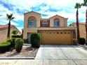 Two-story home boasting a two-car garage, desert landscaping, and a classic Southwest design at 1628 Palmae Way, Las Vegas, NV 89128