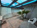 Enclosed courtyard with light and chairs, creating a cozy and inviting outdoor retreat at 2544 Malabar Ave, Las Vegas, NV 89121