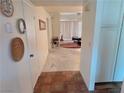 View of an entryway leading to a living room with neutral walls and tile flooring throughout at 2544 Malabar Ave, Las Vegas, NV 89121