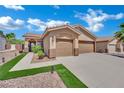 Beautiful home featuring a two-car garage, manicured lawn, and a welcoming front entrance at 2558 Wiltshire Ave, Henderson, NV 89052