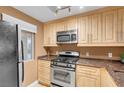 Kitchen featuring stainless steel appliances, light wood cabinets, and good natural light at 270 E Flamingo Rd # 131, Las Vegas, NV 89169
