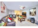 Comfortable living room featuring neutral walls and tile flooring at 4145 Plumtree St, Las Vegas, NV 89115