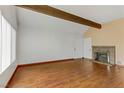 Spacious living room boasts hardwood floors, a brick fireplace, and natural light at 4391 Gannet Cir # 16, Las Vegas, NV 89103