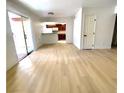 Living room with door leading to a porch, and an open concept kitchen at 4421 Alexis Dr # 429, Las Vegas, NV 89103